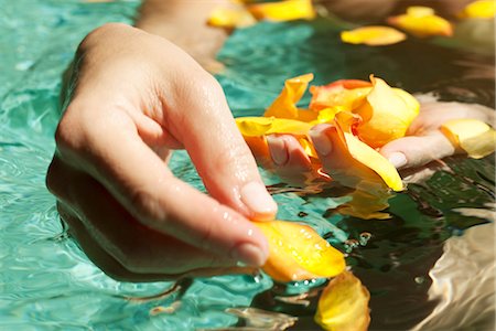 dainty - Gathering flower petals floating on water Stock Photo - Premium Royalty-Free, Code: 632-05604543