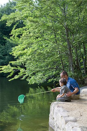 river kids - Father teaching son how to fish Stock Photo - Premium Royalty-Free, Code: 632-05603832