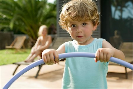 Little boy holding plastic hoop, portrait Stock Photo - Premium Royalty-Free, Code: 632-05603833