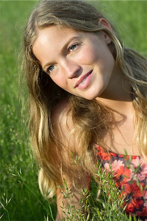 daydreaming in a field - Young woman daydreaming outdoors, portrait Stock Photo - Premium Royalty-Free, Code: 632-05603889