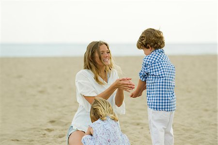 simsearch:632-03027252,k - Mother and children playing in sound at the beach Stock Photo - Premium Royalty-Free, Code: 632-05603921