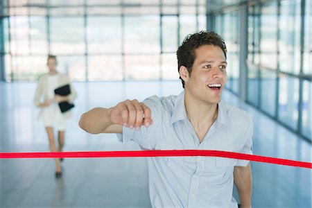 rat race - Businessman crossing finishing line Stock Photo - Premium Royalty-Free, Code: 632-05603965