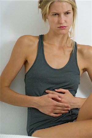 Woman with hands on stomach Stock Photo - Premium Royalty-Free, Code: 632-05759485