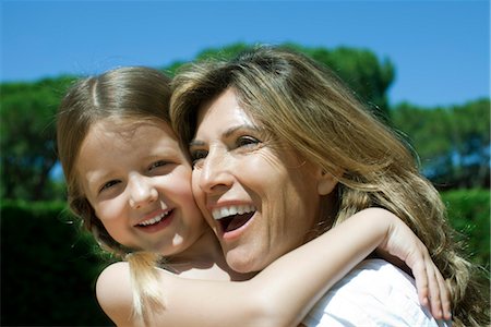 Happy mother and daughter embracing Stock Photo - Premium Royalty-Free, Code: 632-05759534
