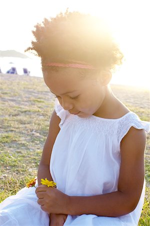 Little girl holding flowers, portrait Stock Photo - Premium Royalty-Free, Code: 632-05759645