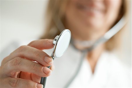 stethoscope - Doctor holding out stethoscope, cropped Stock Photo - Premium Royalty-Free, Code: 632-05759867