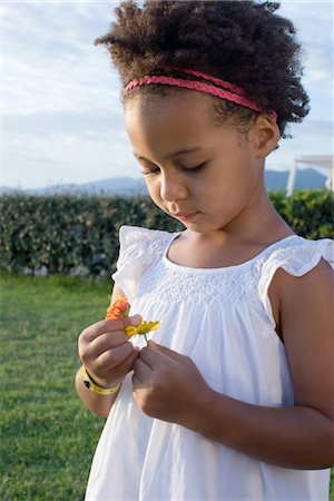 simsearch:632-07674598,k - Little girl looking at flowers Stock Photo - Premium Royalty-Free, Code: 632-05759861