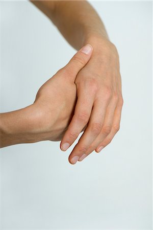 Rubbing hands, cropped Foto de stock - Royalty Free Premium, Número: 632-05759881