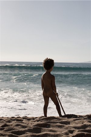 Little girl standing naked at the beach, rear view Stock Photo - Premium Royalty-Free, Code: 632-05759969