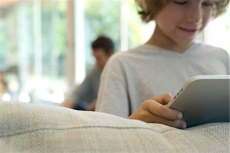 pic of boys in hand mobile - Boy holding digital tablet, selective focus Stock Photo - Premium Royalty-Free, Code: 632-05760019