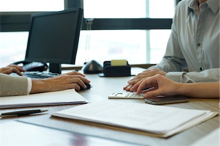 financial planner meeting - Business associates negotiating deal, cropped Stock Photo - Premium Royalty-Free, Code: 632-05760106