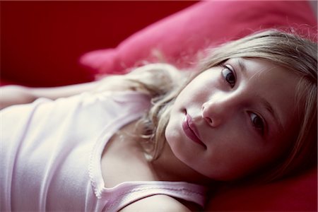 Girl lying on couch, portrait Stock Photo - Premium Royalty-Free, Code: 632-05760155