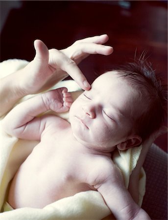 person wrapped - Mother touching new born baby,cropped Stock Photo - Premium Royalty-Free, Code: 632-05760153