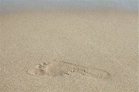 pegadas - Footprint in sand Foto de stock - Royalty Free Premium, Número: 632-05760306