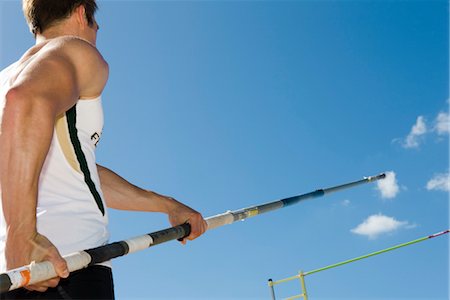 Athlete preparing for pole vault, low angle view Foto de stock - Royalty Free Premium, Número: 632-05760470