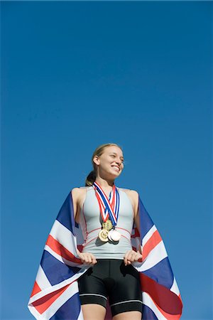 podium winner - Female athlete being honored on podium Stock Photo - Premium Royalty-Free, Code: 632-05760517