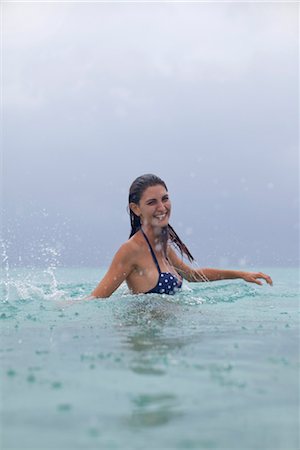 Woman splashing in water Stock Photo - Premium Royalty-Free, Code: 632-05760571