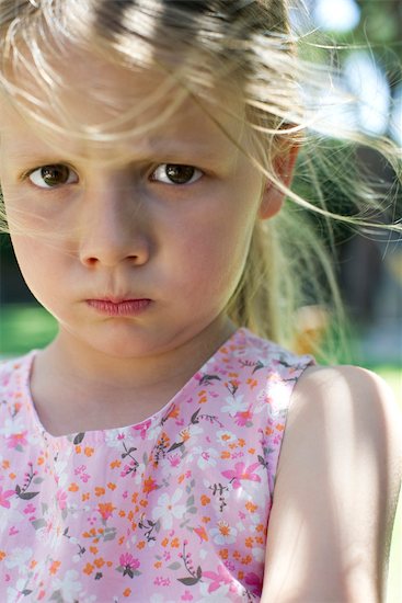 Little girl pulling face Stock Photo - Premium Royalty-Free, Image code: 632-05760638