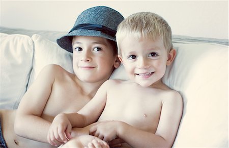 simsearch:632-05760167,k - Young brothers sitting on sofa, portrait Stock Photo - Premium Royalty-Free, Code: 632-05760657