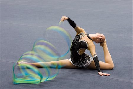 Female gymnast performing floor routine with ribbon Stock Photo - Premium Royalty-Free, Code: 632-05760671