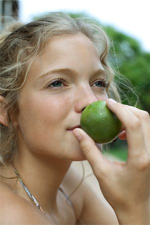 photography smelling fruit - Woman smelling lime Stock Photo - Premium Royalty-Free, Code: 632-05760683