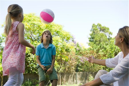 family play ball - Grandmother watching grandchildren playing with ball Stock Photo - Premium Royalty-Free, Code: 632-05760721