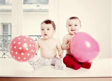 Baby girls with balloons, portrait Stock Photo - Premium Royalty-Free, Code: 632-05760757