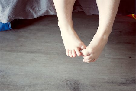 Child's dangling bare feet Stock Photo - Premium Royalty-Free, Code: 632-05816123
