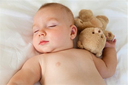 simsearch:632-06779368,k - Baby sleeping with teddy bear Stock Photo - Premium Royalty-Free, Code: 632-05816219