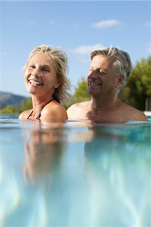 refraction - Mature couple relaxing together in pool Stock Photo - Premium Royalty-Free, Code: 632-05816342