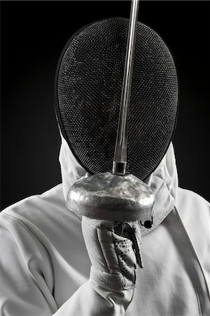 esgrima - Fencer holding up foil, portrait Foto de stock - Sin royalties Premium, Código: 632-05816467