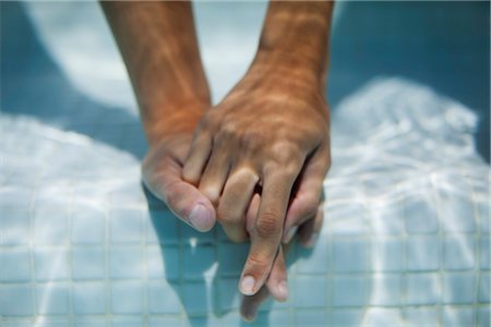 day time underwater - Couple holding hands underwater, cropped Stock Photo - Premium Royalty-Free, Code: 632-05816728