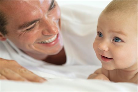 dad and baby laughing - Father and baby bonding Stock Photo - Premium Royalty-Free, Code: 632-05816746
