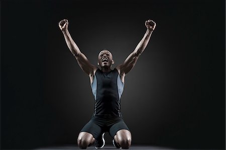 Male athlete shouting with arms raised Foto de stock - Sin royalties Premium, Código: 632-05816756