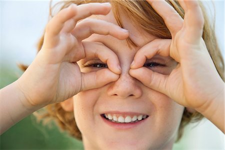 Boy making faces at camera, portrait Stock Photo - Premium Royalty-Free, Code: 632-05816757