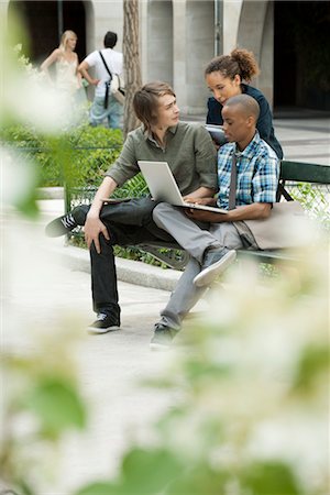 sitting on bench - University students studying on campus with laptop computer Stock Photo - Premium Royalty-Free, Code: 632-05816889