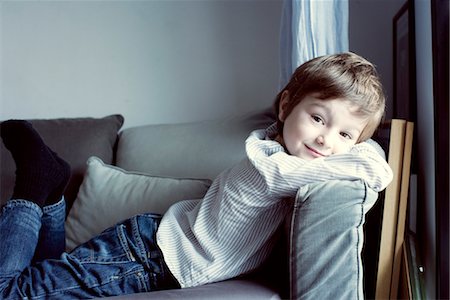 side view relaxing couch - Boy relaxing on sofa, portrait Stock Photo - Premium Royalty-Free, Code: 632-05816905