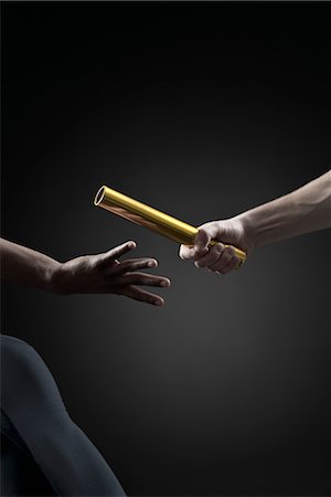 relay - Runners passing baton, cropped Stock Photo - Premium Royalty-Free, Code: 632-05817009