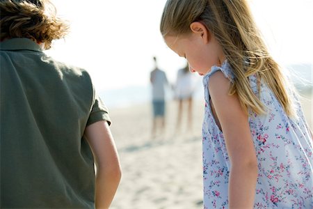 Boy and girl at the beach, rear view Stock Photo - Premium Royalty-Free, Code: 632-05817043