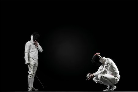 esgrima - Winning fencer and defeated fencer Foto de stock - Sin royalties Premium, Código: 632-05817116