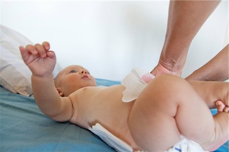 diapering - Baby having diaper changed, cropped Stock Photo - Premium Royalty-Free, Code: 632-05817117