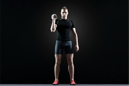 simsearch:632-05816533,k - Shot putter holding shot Stock Photo - Premium Royalty-Free, Code: 632-05817121