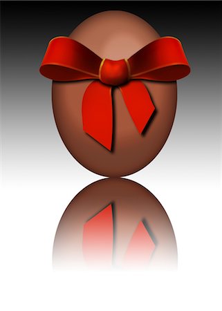 easter chocolate - Chocolate Easter egg wrapped in red bow Stock Photo - Premium Royalty-Free, Code: 632-05817190