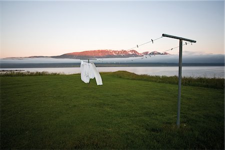 Laundry drying on clothes-line in remote landscape, Vopnafjordur, Iceland Stock Photo - Premium Royalty-Free, Code: 632-05845014
