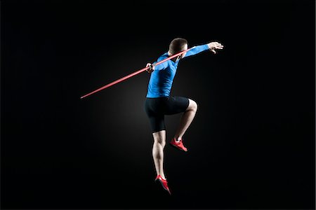 Male athlete leaping with javelin Stock Photo - Premium Royalty-Free, Code: 632-05845097