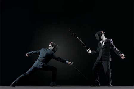 person lunge - Businessmen fencing Stock Photo - Premium Royalty-Free, Code: 632-05845116