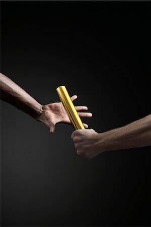 relay runner - Runners passing baton, cropped Stock Photo - Premium Royalty-Free, Code: 632-05845139