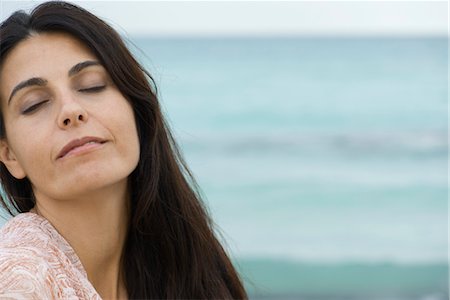 simsearch:632-05992190,k - Woman at the beach, eyes closed, portrait Stock Photo - Premium Royalty-Free, Code: 632-05845145