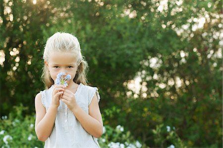 Girl smelling flowers Stock Photo - Premium Royalty-Free, Code: 632-05845158