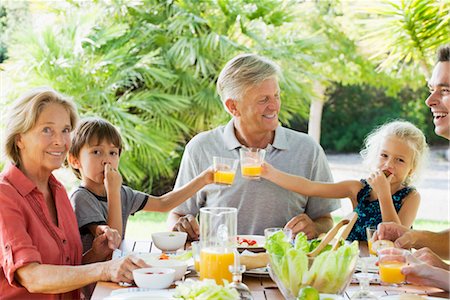 salad bowl - Multi-generation family enjoying meal outdoors Stock Photo - Premium Royalty-Free, Code: 632-05845160